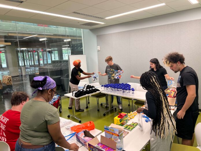 UofL students sort supplies as part of a five-day alternative service break in Chicago focused on environmental and housing justice.