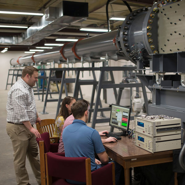 Faculty and students working on wind tunnel research