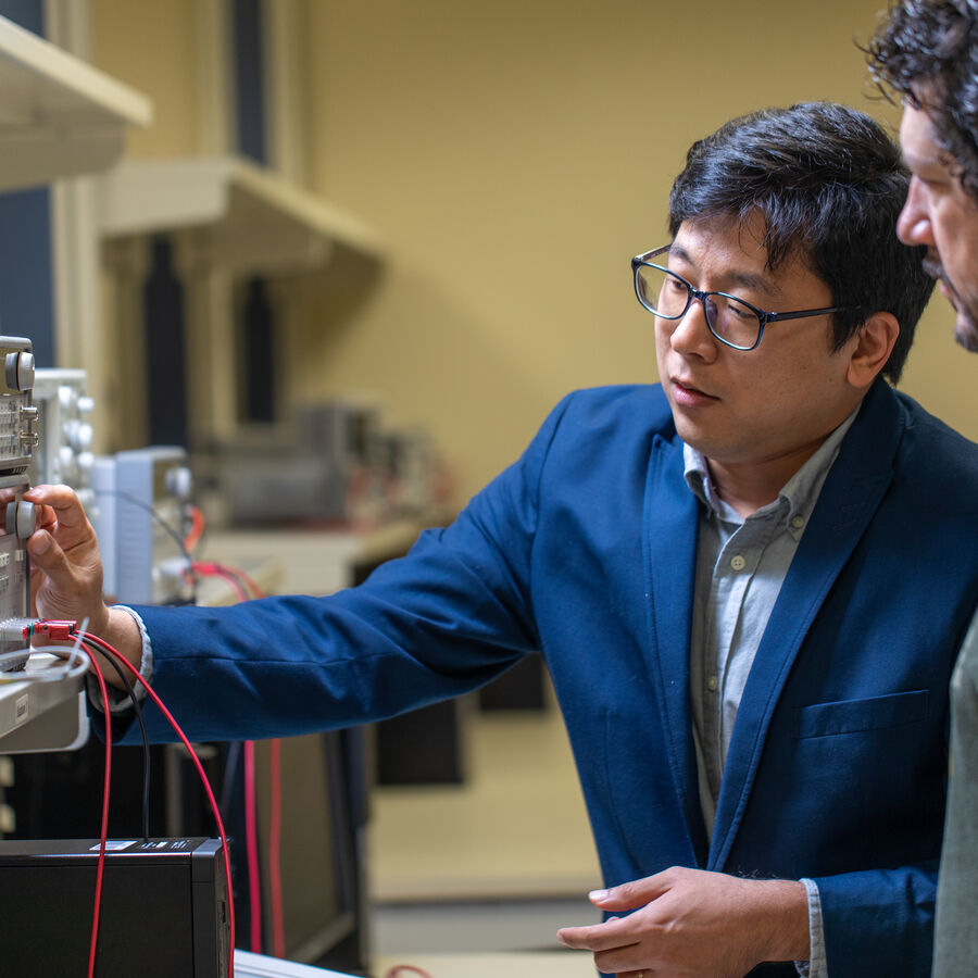 Professor and student interacting on an electric engineering project in UT Tyler's College of Engineering