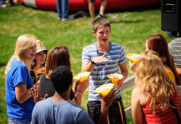 Students work with a residence life coordinator in an activity.