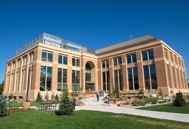 The Science Initiative building against a blue sky on campus.