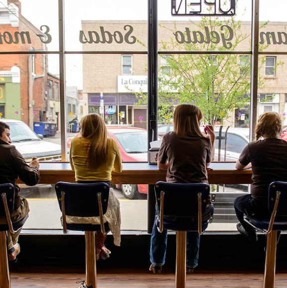 Students sit together in an ice cream shop