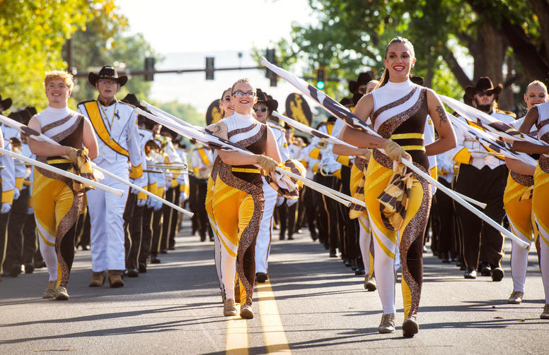 color gaurd memebers march in a parade