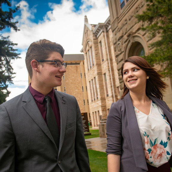 Two people wearing suits