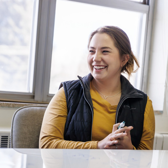 Person laughing in meeting