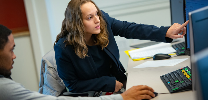 students looking at a computer screen. 