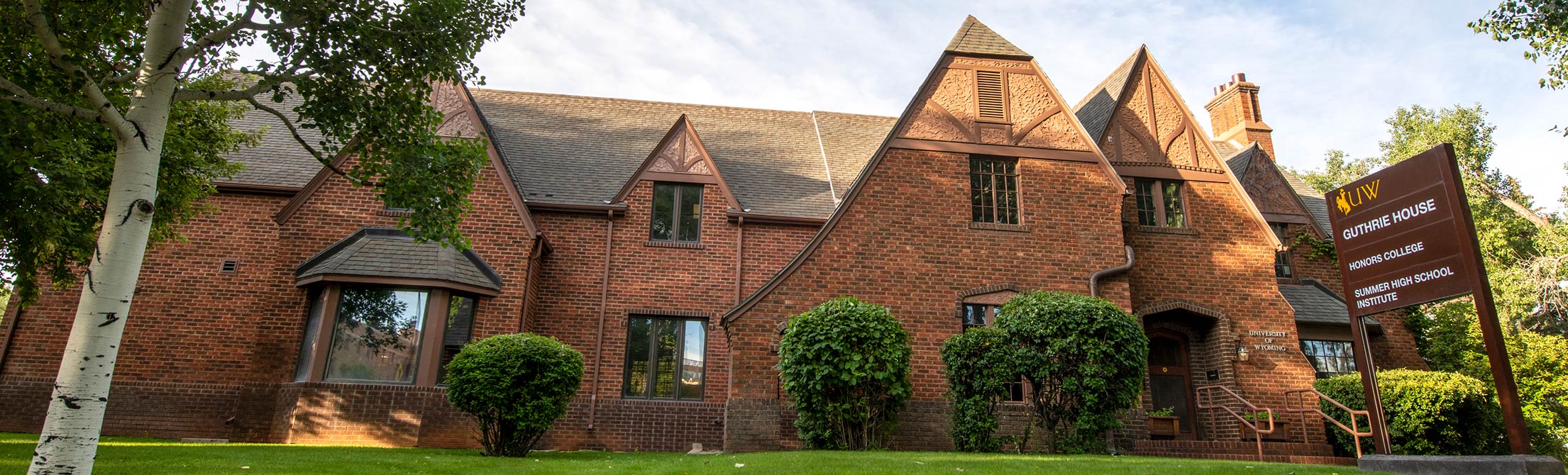 pictures of a large brick house with a logo between them