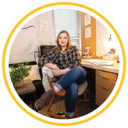 Female student sitting at her desk in a residence hall room