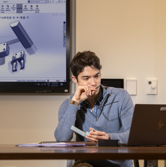 photo of undergraduate student working at a computer