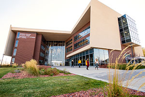 large building with people on the sidewalk from it