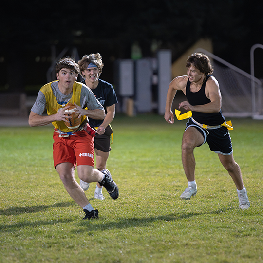 Students play intramural flag football