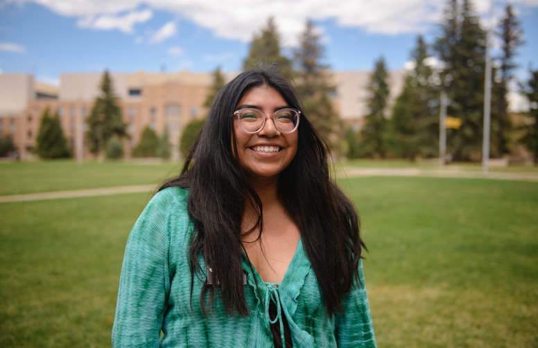 student smiling at the camera