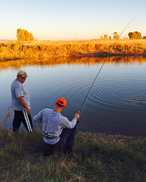 Veterans fly fishing at local lake.