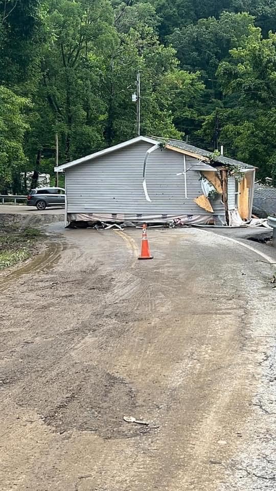 House swept onto Steer Fork Rd in Mallie, KY by flash flooding