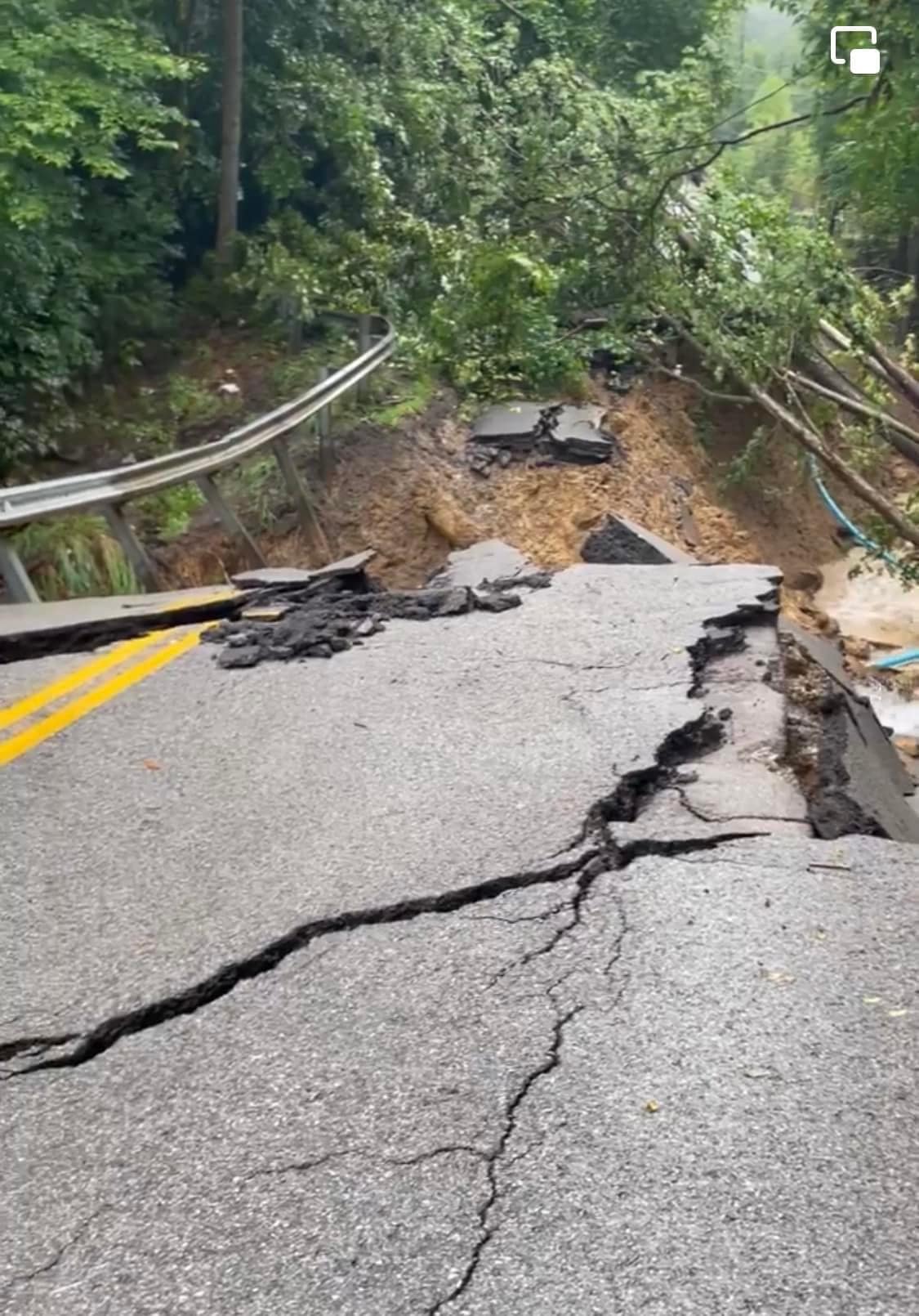 A road near Willard Branch in Pinetop, KY washed away by flash flooding