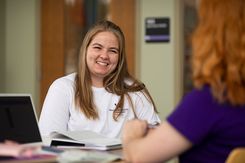 student laughing in conversation